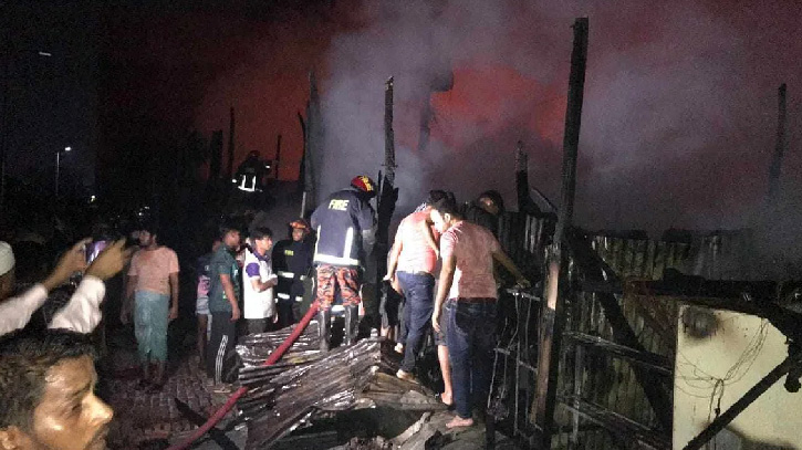 Fire service members investigate after the fire was brought under control