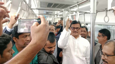 Khalid Mahmud rides metro rail with regular passengers