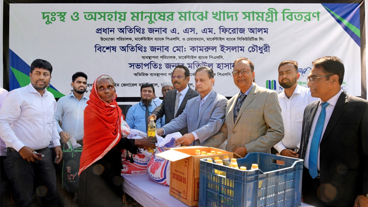 Mercantile Bank distributes food items to 900 families Mercantile Bank distributes food items to 900 families