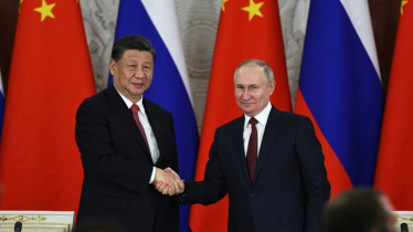 Xi meets Russia’s Putin on a state visit to China