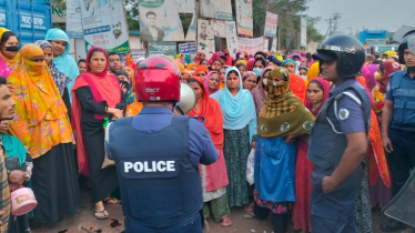 Workers protesting for salary, Eid bonus block road in Gazipur