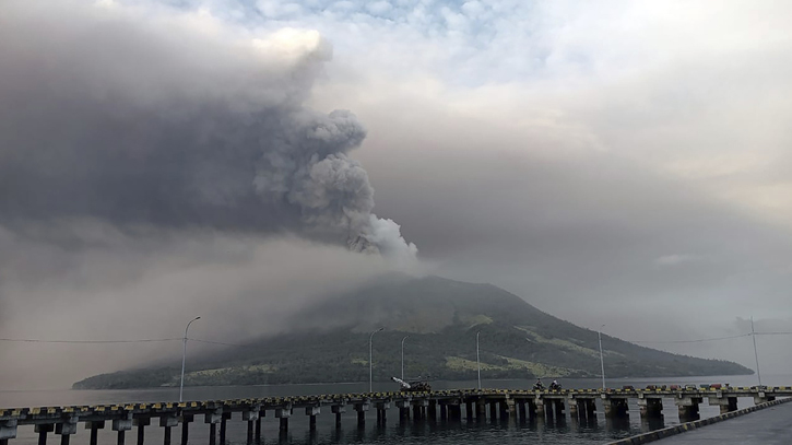 Indonesians leave homes near erupting volcano and airport closes due to ash danger